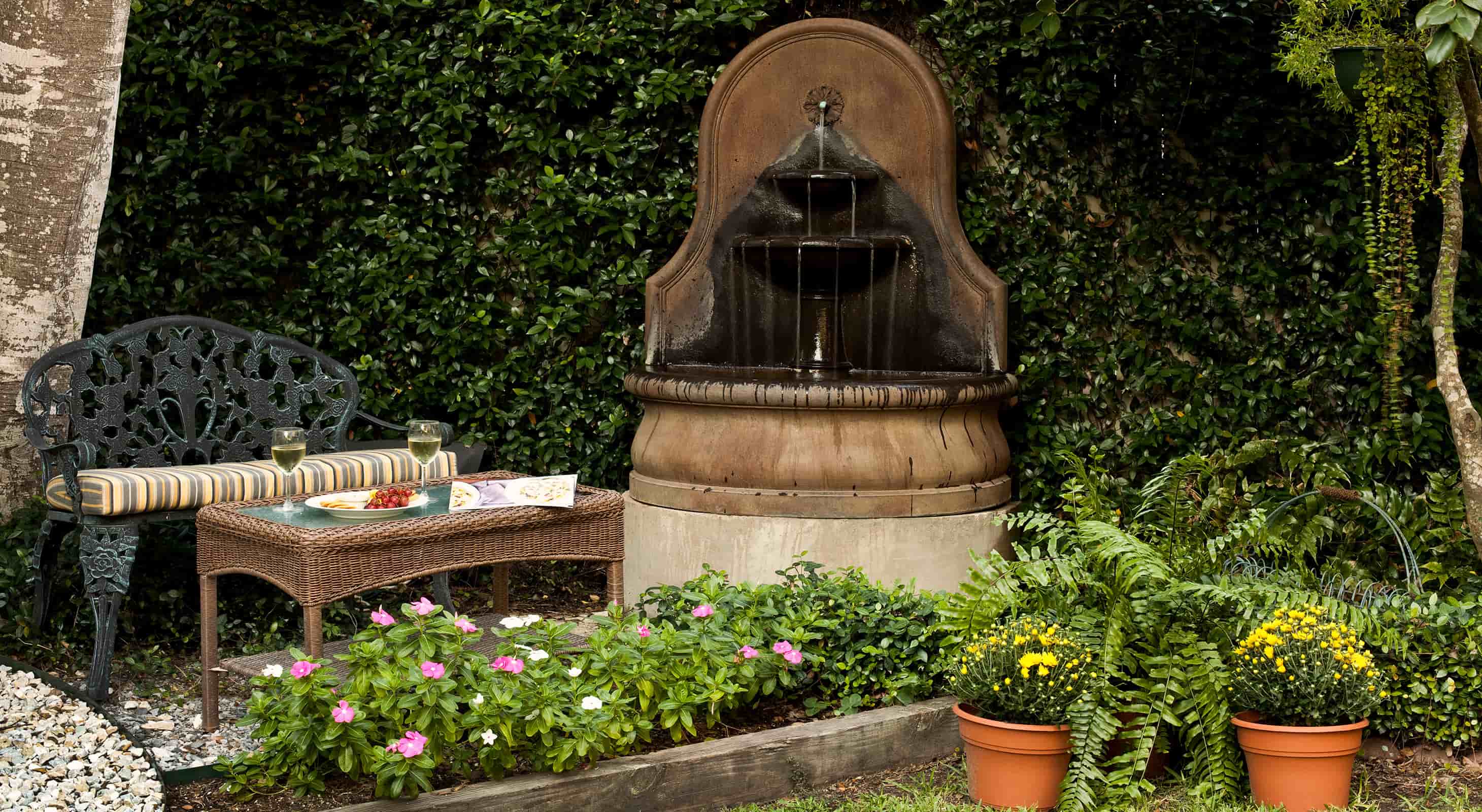 seating area and fountain in a garden